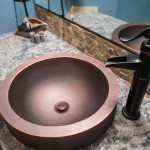 copper sink and faucet with granite counter top