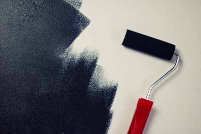 Painting roller on wall